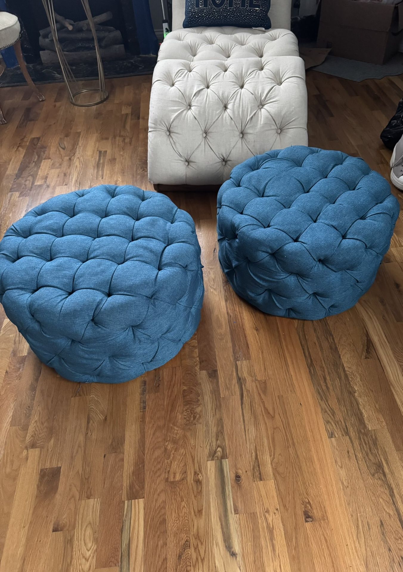 Two Blue Ottomans