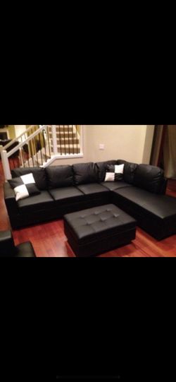 Sectional sofa with storage ottoman and accent pillows black leather