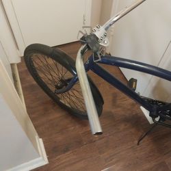 2 Bycycles, One With Motor. 