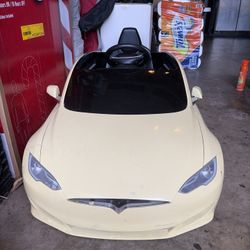 Kids Tesla-style electric ride-on car