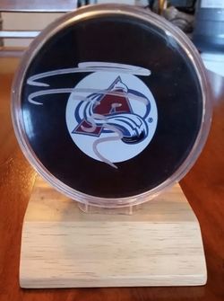 Signed Adam Foote #23 Avalanche hockey puck