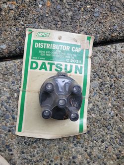 Datsun distributor cap nos