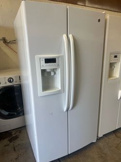 Shiny white GE side-by-side water and icemaker can deliver