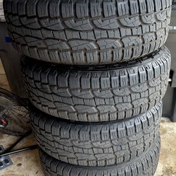 P275-60 R20 Set of all terrain tires with rims 5lug with nuts