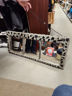 needs little love on the corners. mosaic 3 pane mirror.