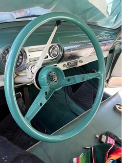 57. Steering wheel cut down to a 14 inch.