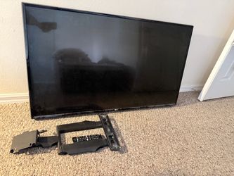 LG 55 inch television with wall mount and remote control