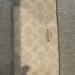 Coach Signature Zip-Around Continental Wallet in the Signature Canvas  