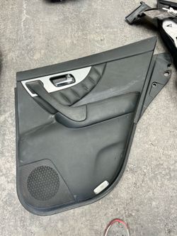 This is a rear interior door trim panel for a 2009-2017 Infiniti FX35, FX37, FX50, or QX70