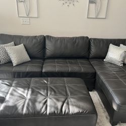 Leather Three Piece Sectional W/attached Chaise And Ottoman 