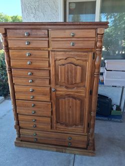 wood dresser.  good condition.  
18 inches depth. 
41  inches long
59 inches tall

8 drawers,  and 1 storage with 2 levels.