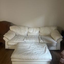 Leather Couch And Ottoman + Two Red Chairs 