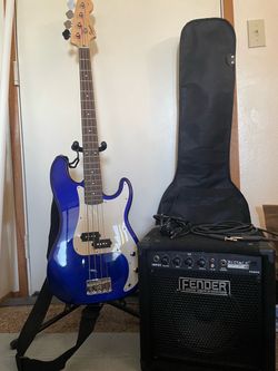 $50 Fender bass guitar with cover, stand, and amplifier