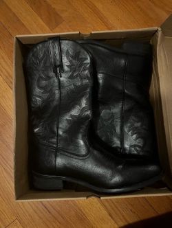 Woman’s black leather boots