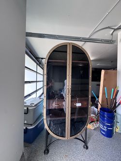 Modern speak easy style glass and metal  cabinet / restoration hardware style