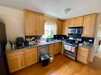 Wooden Kitchen Cabinet with Laminate Top, Gas Range and Microwave. 42” hight.