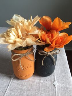 Distressed mason jar vases with flowers included!! Jar/flower choices shown in photos $12 for both!!!