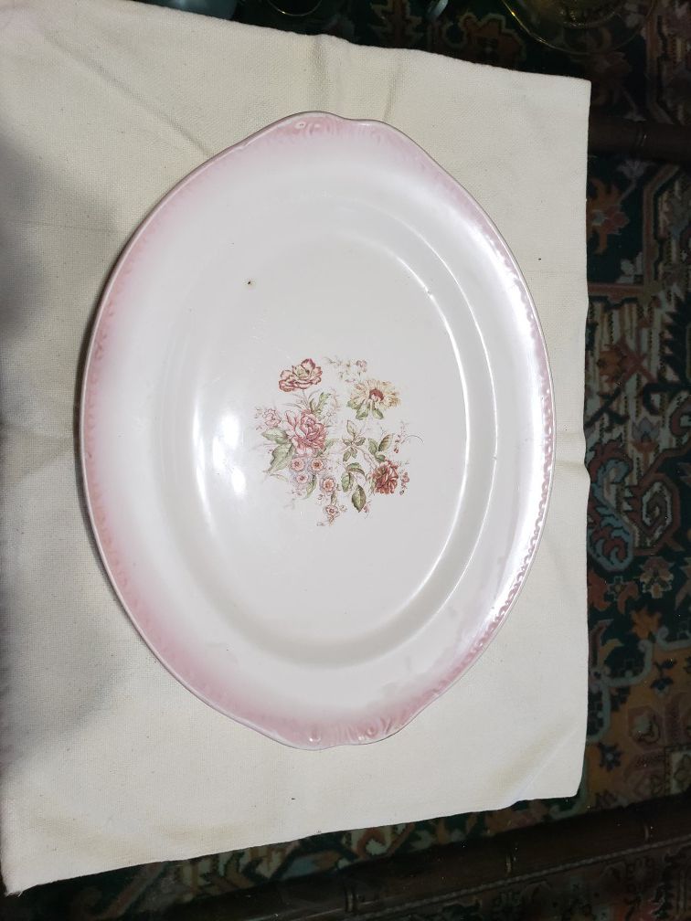Antique serving tray with pink outline
