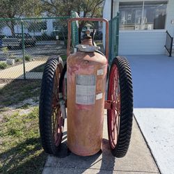 Antique fire extinguisher on wheels