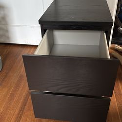 2 matching black dressers