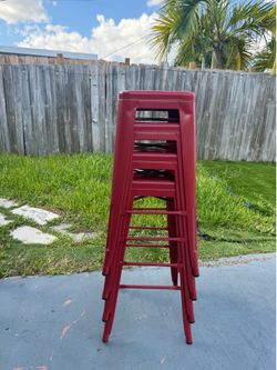 Set of 4 red metal stackable bar stools