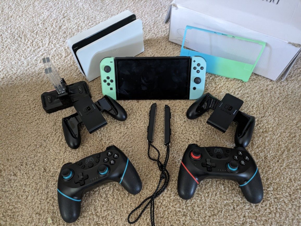 Nintendo Switch OLED With Accessories And 8 Games 