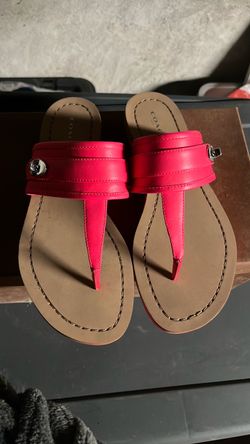 Coach hot pink/fuchsia thong sandals featuring a sleek, modern design with a casual yet sophisticated look.