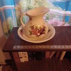 Decorative floral pitcher and basin set, perfect for home decor.