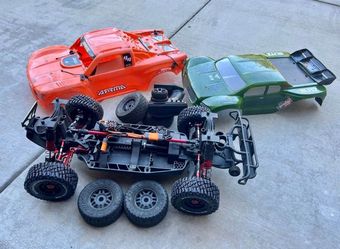 Arrma Mojave 4s 1/8 scale brushless 4x4 withaluminum parts paired with spektrum
transmitter.