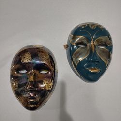 Two Porcelain Masks for Decoration 9 inches high by 6 inches wide.