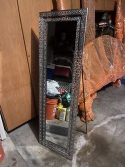 Free standing metal mirror
