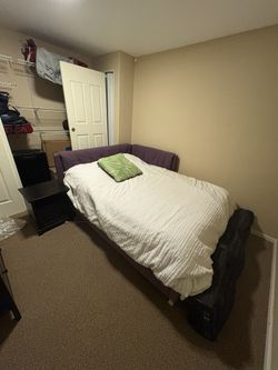 Purple full-size bed with mattress