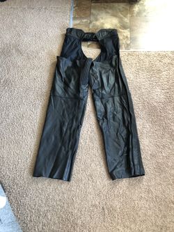 Leather motorcycle chaps size medium, worn twice only, practically brand new.