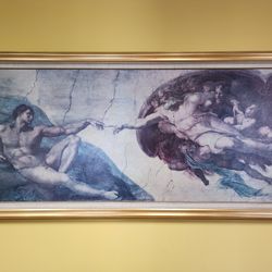The Creation of Adam," a famous fresco by Michelangelo