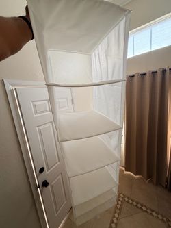 Two hanging closet shelves