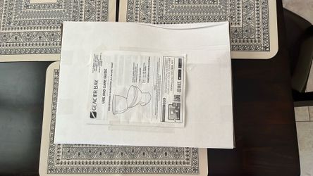 Brand new Glacier Bay toilet seat in box