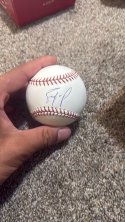 An official baseball autographed by Ty France