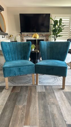 Turquoise accent chairs with pillows