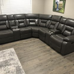 New Reclining Sectional.  Grey Gel Leatherette.  106” X 106”.  Free Delivery!