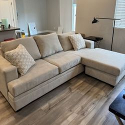 Beige Living Spaces 98” Sectional Sofa & Matching Ottoman Set
