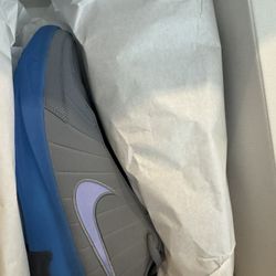 It’s the Nike LeBron Witness IX in the Cool Grey / Aurora Blue colorway.