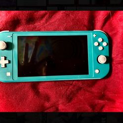 Nintendo Switch Lite - Turquoise. 100% fully operational and functions as intended. 