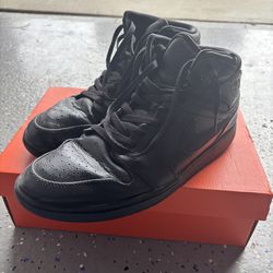 Mid black Air Jordan 1s
