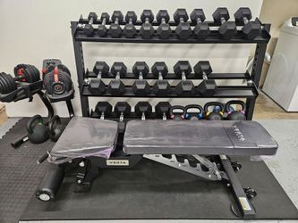 New - Rubber Hex dumbbells, rack, bench and floor mat.