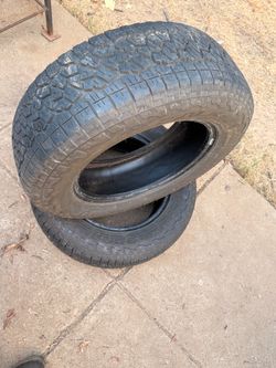 Set Of 2 FALKEN WILDPEAK A/T AT3W 235/65R17. One tire has a Patch.