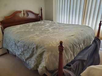 Queen Bed. Complete. Headboard and foot boards solid wood.  Comes with mattress