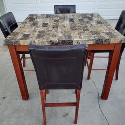 Sporty Looking  Dining Room Table And Chairs 