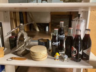 Vintage Coca-Cola Collectible Lot – Glass Bottles, Soda Fountain Dispenser & Surfer Statue