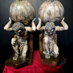 MCM pair of Greek Titan Atlas decorative bookends, designed to hold books on a shelf or desk.10" Tall