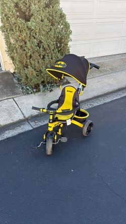 Kids Embrace Batman Tricycle